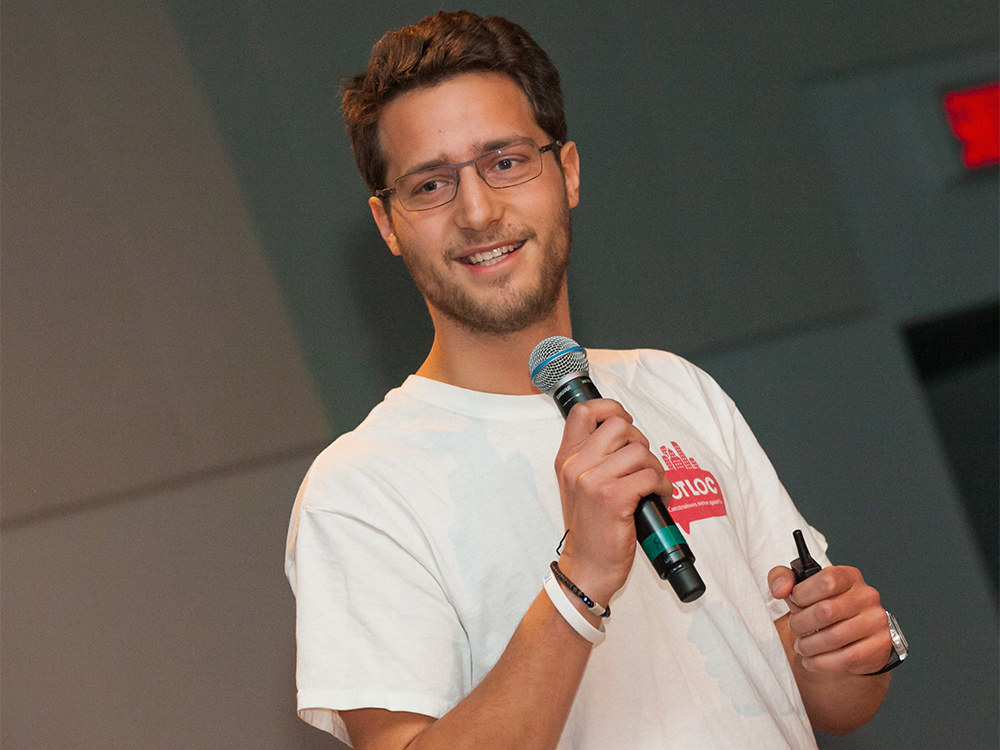 Rodoplhe Barrere holding a microphone